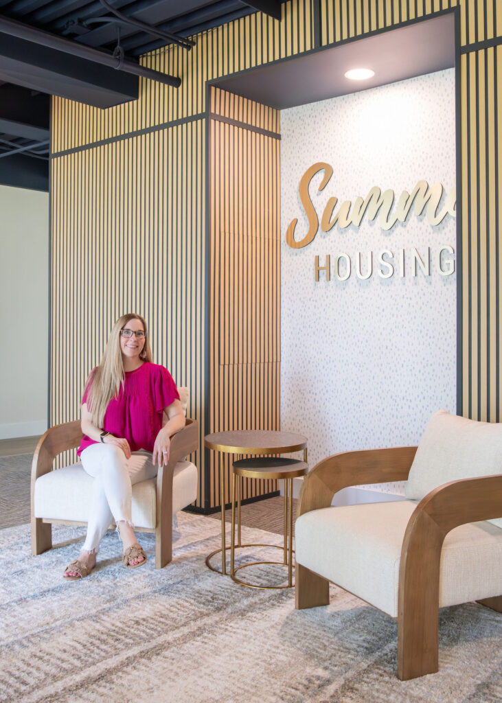 Main lobby of office building, Julianna Watts, Senior designer, sitting on the chairs. Cuyahoga Falls Ohio. Lindsey Putzier interior design