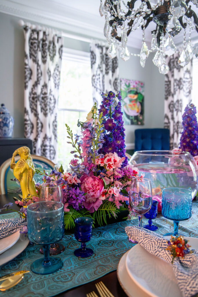 Dining room with purple and pink arrangements that incudes a fish bowl with live fish Hudson Home and Garden Show 2026, interior design, Lindsey Putzier