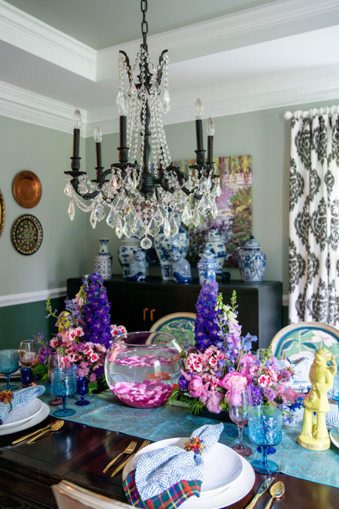 Dining room with purple and pink arrangements that incudes a fish bowl with live fish Hudson Home and Garden Show 2026, interior design, Lindsey Putzier