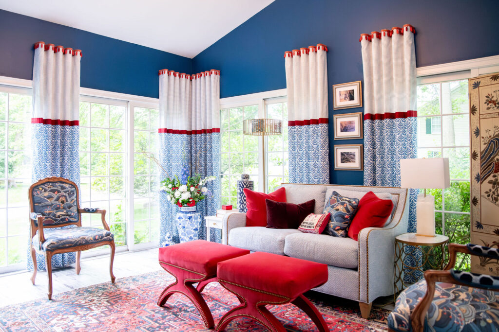 Sunroom with blue and red furnishings Hudson Home and Garden Show 2026, interior design, Lindsey Putzier