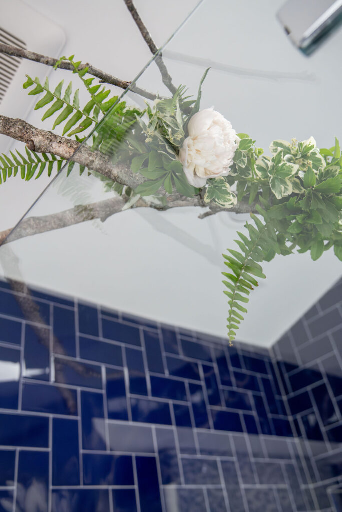 Floral arrangement in the master bathroom with a tree branch Hudson Home and Garden Show 2026, interior design, Lindsey Putzier