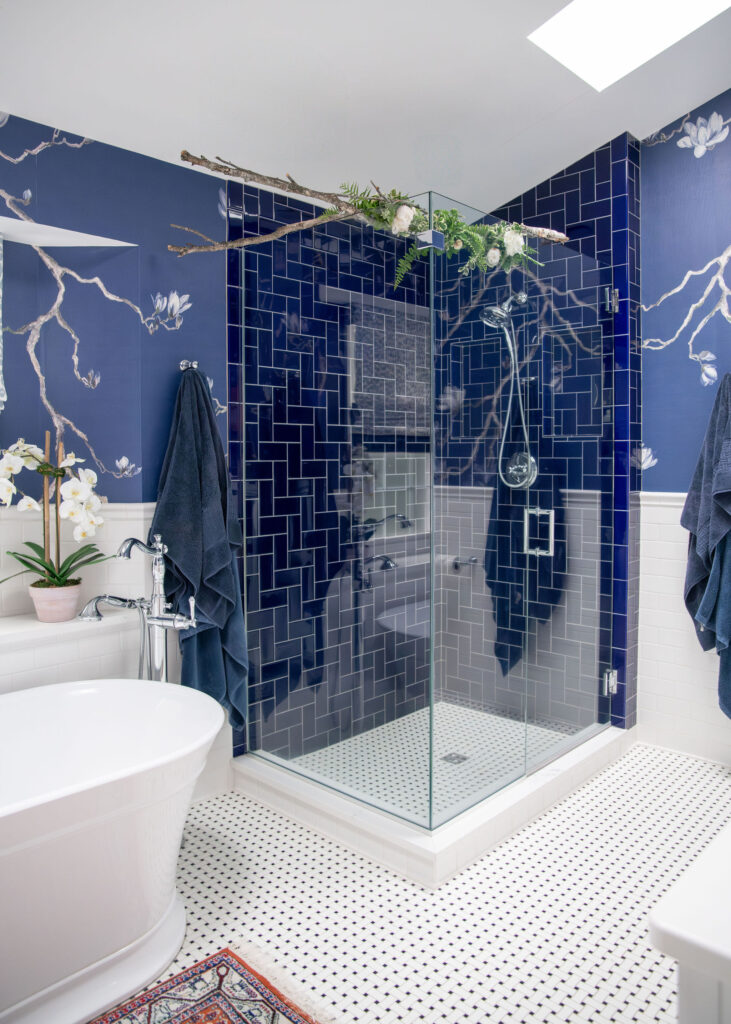 Master bathroom with dark blue tile and large shower