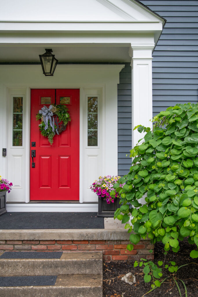 Updated front porch with wreath and flower arrangements Hudson Home and Garden Show 2026, interior design, Lindsey Putzier
