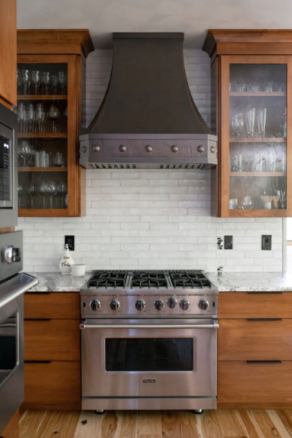 Kitchen with a dark range and black hardware. Hudson Ohio interior design Lindsey Putzier 