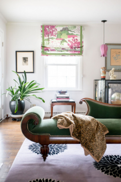 Maximalist living room with window treatments that are pink and green Hudson Ohio interior design Lindsey Putzier 