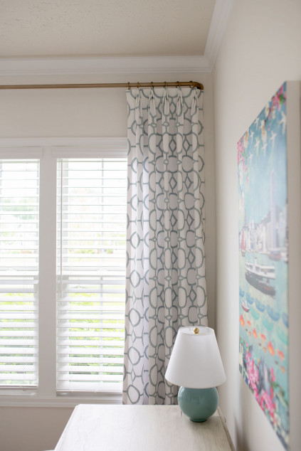 Gold rode with black rings and curtains. Hudson Ohio interior design Lindsey Putzier 