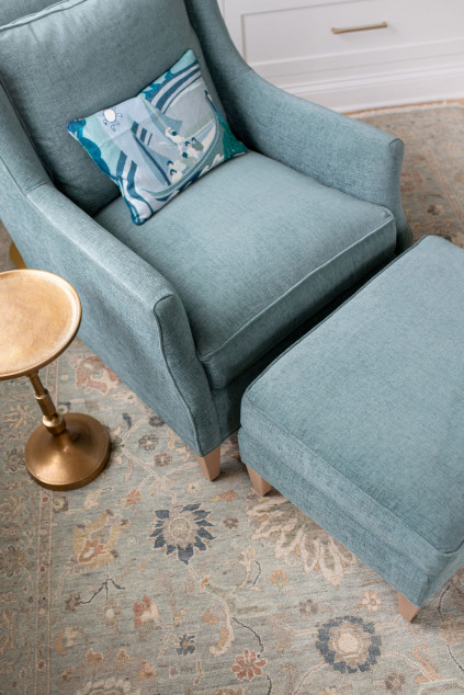 Blue reading chair and blue accented rug. Hudson Ohio interior design Lindsey Putzier 