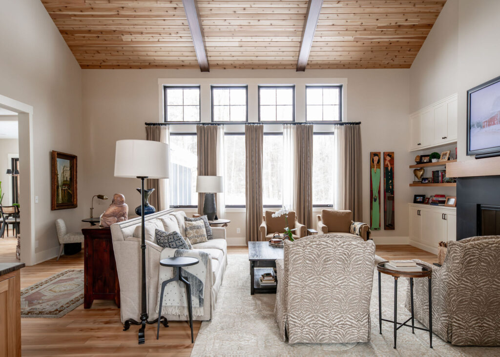 Living room with long curtains and a large rod. Hudson Ohio interior design Lindsey Putzier 