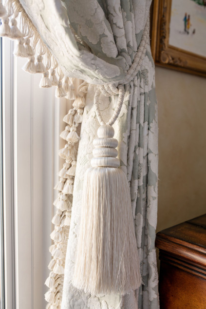 Large white tassel to tie back the drapes. Hudson Ohio interior design Lindsey Putzier 