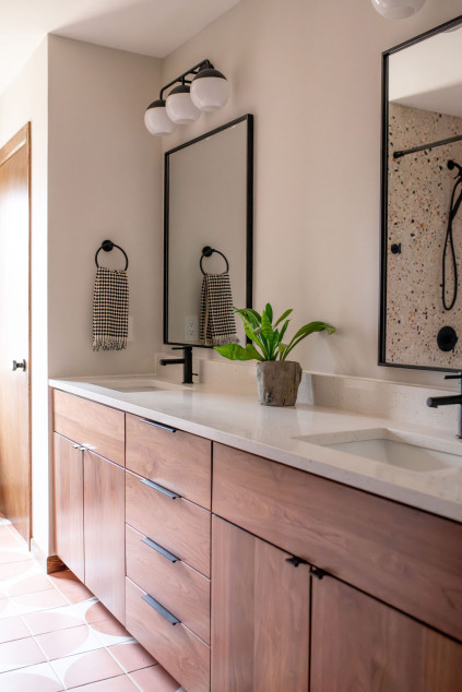 Bathroom with double sinks and over the mirror black light fixtures Hudson Ohio interior design Lindsey Putzier 