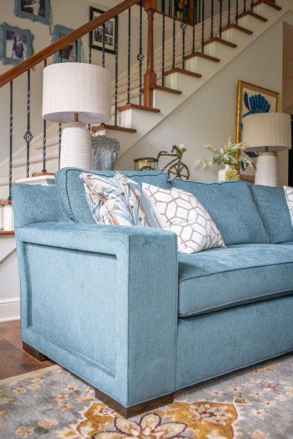 Living room with custom blue couch in performance fabric. Hudson Ohio interior design Lindsey Putzier 