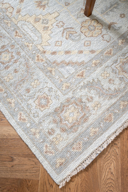 Vintage inspired rug with hardwood flooring. Hudson Ohio interior design Lindsey Putzier 