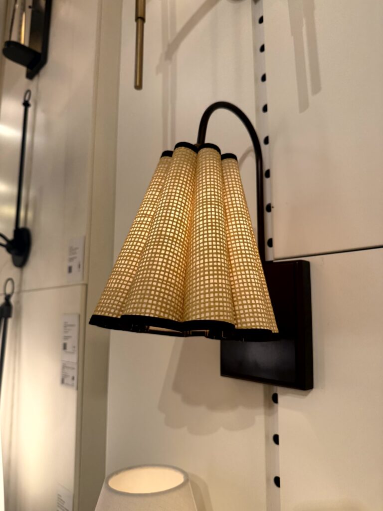 Small wall sconce with scalloped shade. High Point Market Lindsey Putzier interior design, Hudson Ohio 