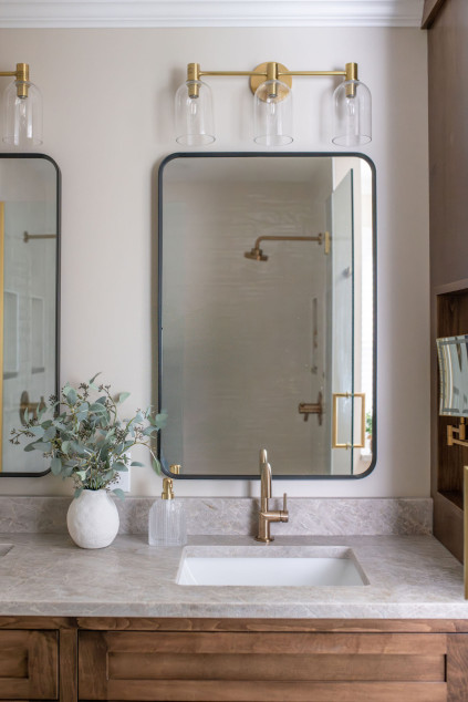 Bathroom with new countertops, mirrors, and lighting fixture. Lindsey Putzier interior design Hudson Ohio