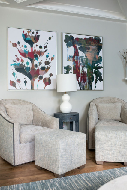 living room with large paintings anf custom swivel chairs. Lindsey Putzier interior design Hudson Ohio 