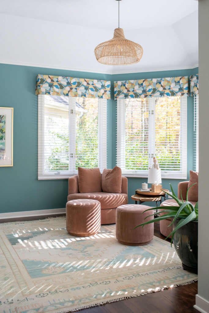 Sitting room with circular chairs, custom window treatments anf large area rug. Lindsey Putzier interior design Hudson Ohio