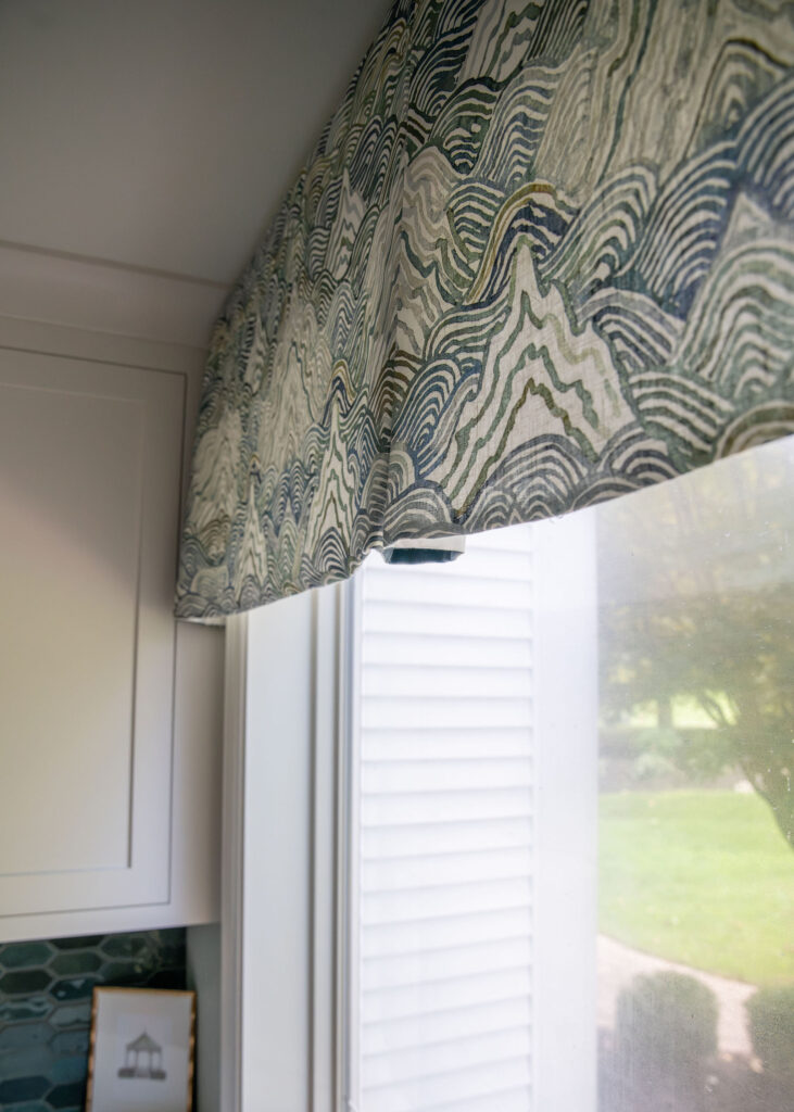 Custom window treatment in the mudroom with blue pattern. Lindsey Putzier interior design Hudson Ohio