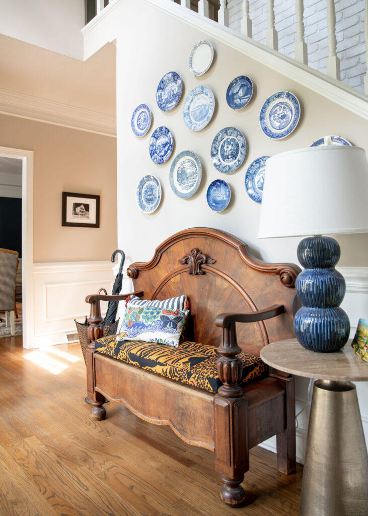 Front hallway with blue plates hung on the wall. Hudson Ohio Interior design Lindsey Putzier