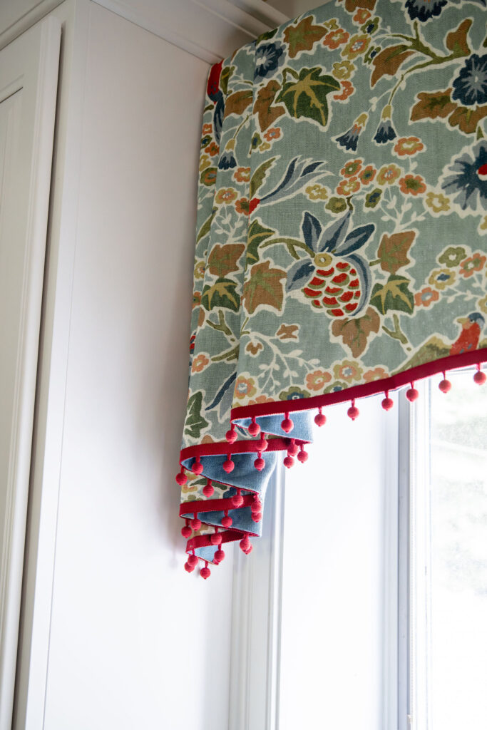 850 736Custom window treatment in the kitchen with fringe edge overtop the sink and marble countertops. Hudson Ohio Interior design Lindsey Putzier3