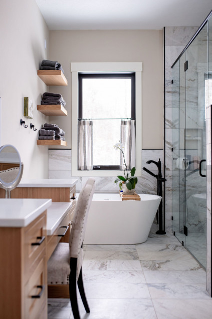 Bathroom with marble tile flooring, large shower and built in vanity. Lindsey Putzier interior design Hudson Ohio 