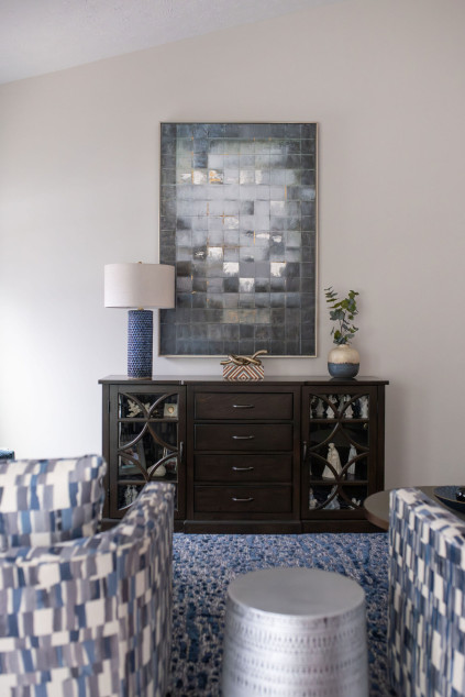 Large tile art piece hanging in the living room Lindsey Putzier interior design Hudson Ohio