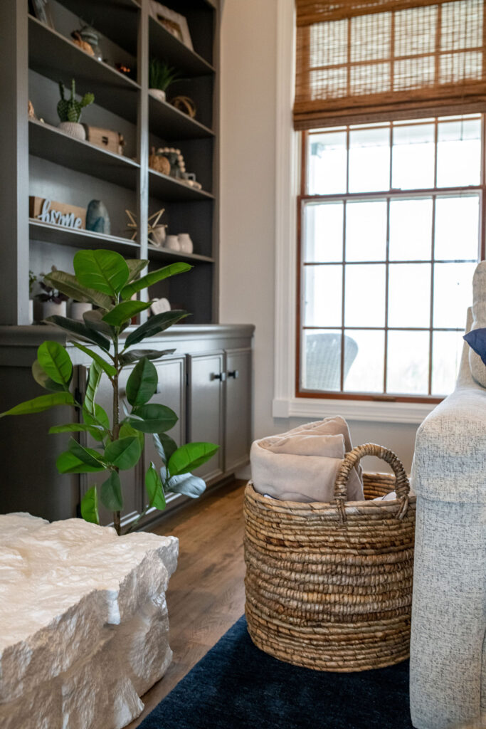 living room with styled bookshelves. Lindsey Putzier interior design Hudson Ohio