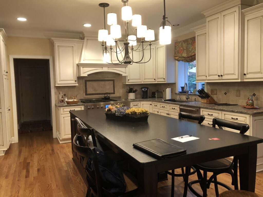 Before of the kitchen with date lighting, colors and backsplash.  Lindsey Putzier interior design Hudson Ohio 